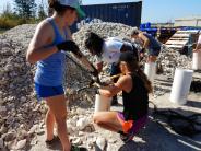 Volunteers bagging shell for oyster reef